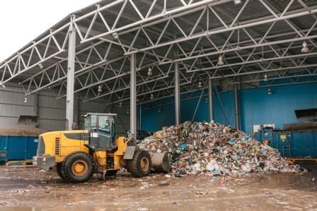 tractor pushing garbage