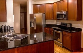 brown kitchen with stainless appliances 