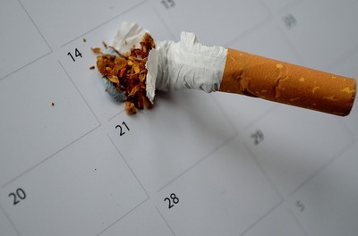 cigarette crushed on a calendar