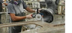 Person Fabricating Engineered Stone dusty